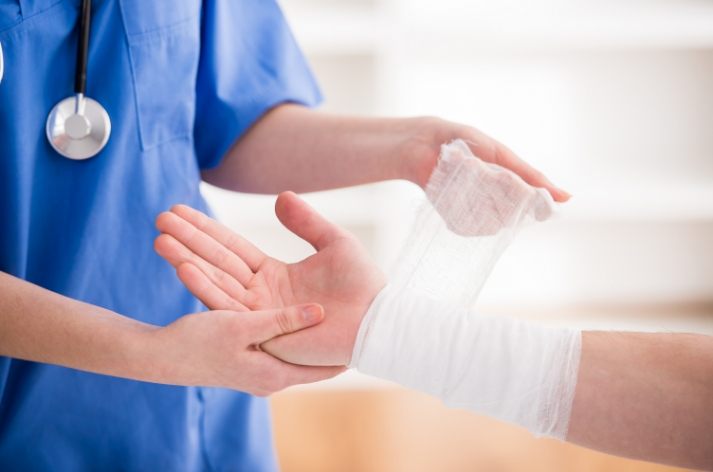 Clinician providing hands-on rehabilitation therapy