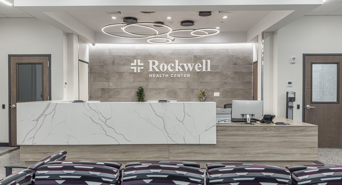 The Rockwell reception area beneath the branded sign