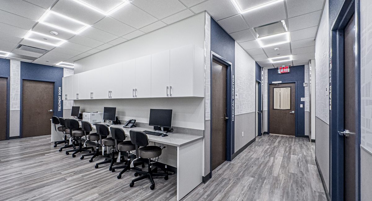 A Rockwell clinical corridor with treatment and exam rooms