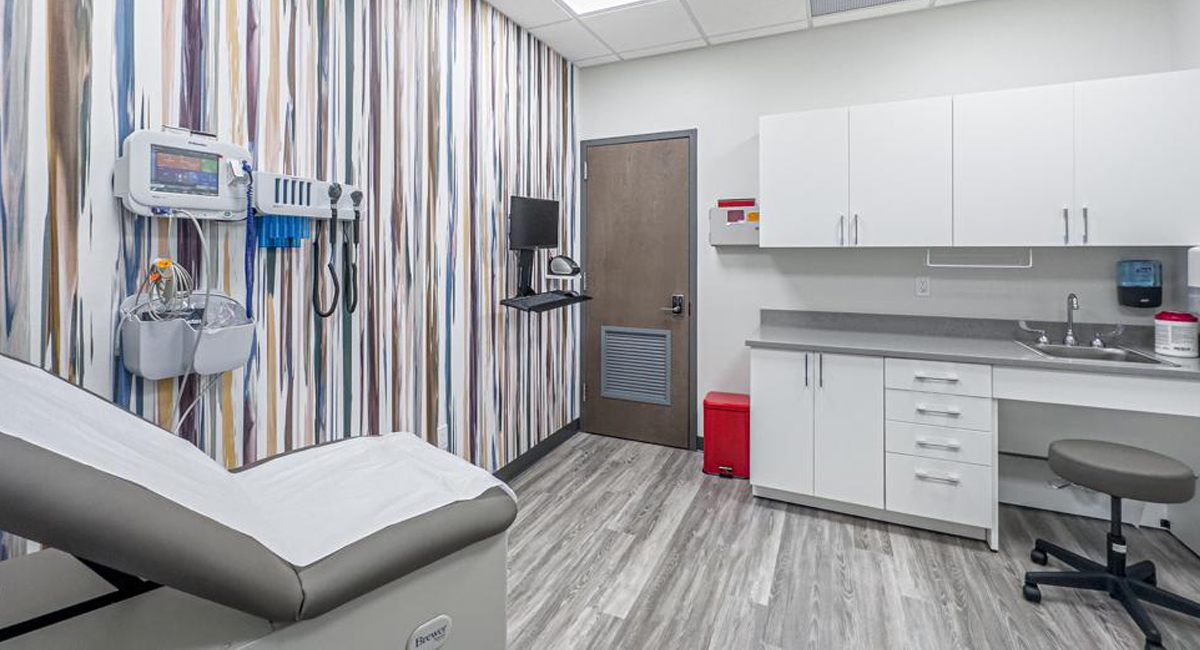 A Rockwell specialty exam room with a monitoring station and diagnostic instruments