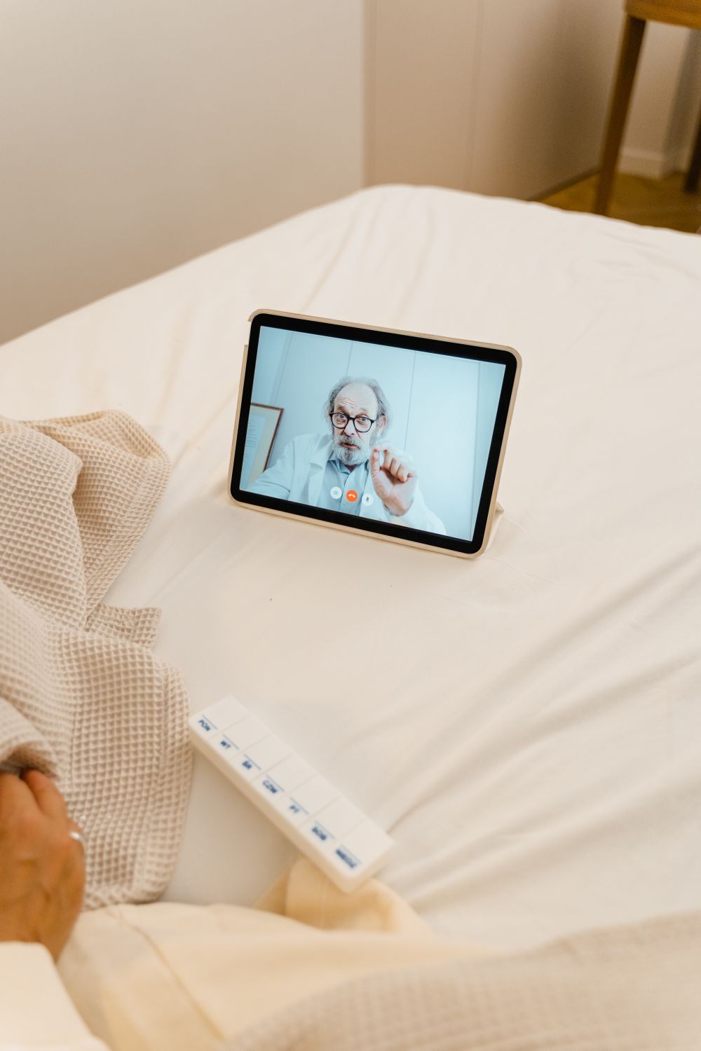A patient on a video call with a Rockwell provider during a telehealth visit